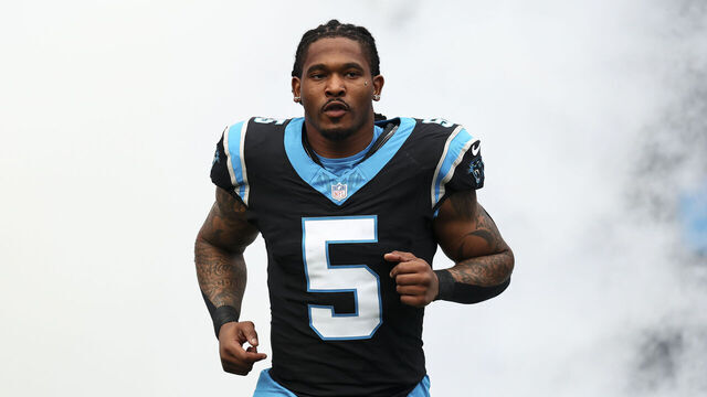 CHARLOTTE, NORTH CAROLINA - JANUARY 10: Rico Dowdle #5 of the Carolina Panthers runs onto the field prior to an NFL wild card playoff football game against the Los Angeles Rams at Bank of America Stadium on January 10, 2026 in Charlotte, North Carolina.