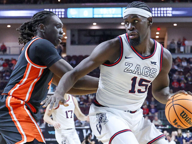 LAS VEGAS, NEVADA - MARCH 09: Graham Ike #15 of the Gonzaga Bulldogs drives against Yaak Yaak #4 of the Oregon State Beavers in the first half of a semifinal game of the West Coast Conference men's basketball tournament at the Orleans Arena on March 09, 2026 in Las Vegas, Nevada.