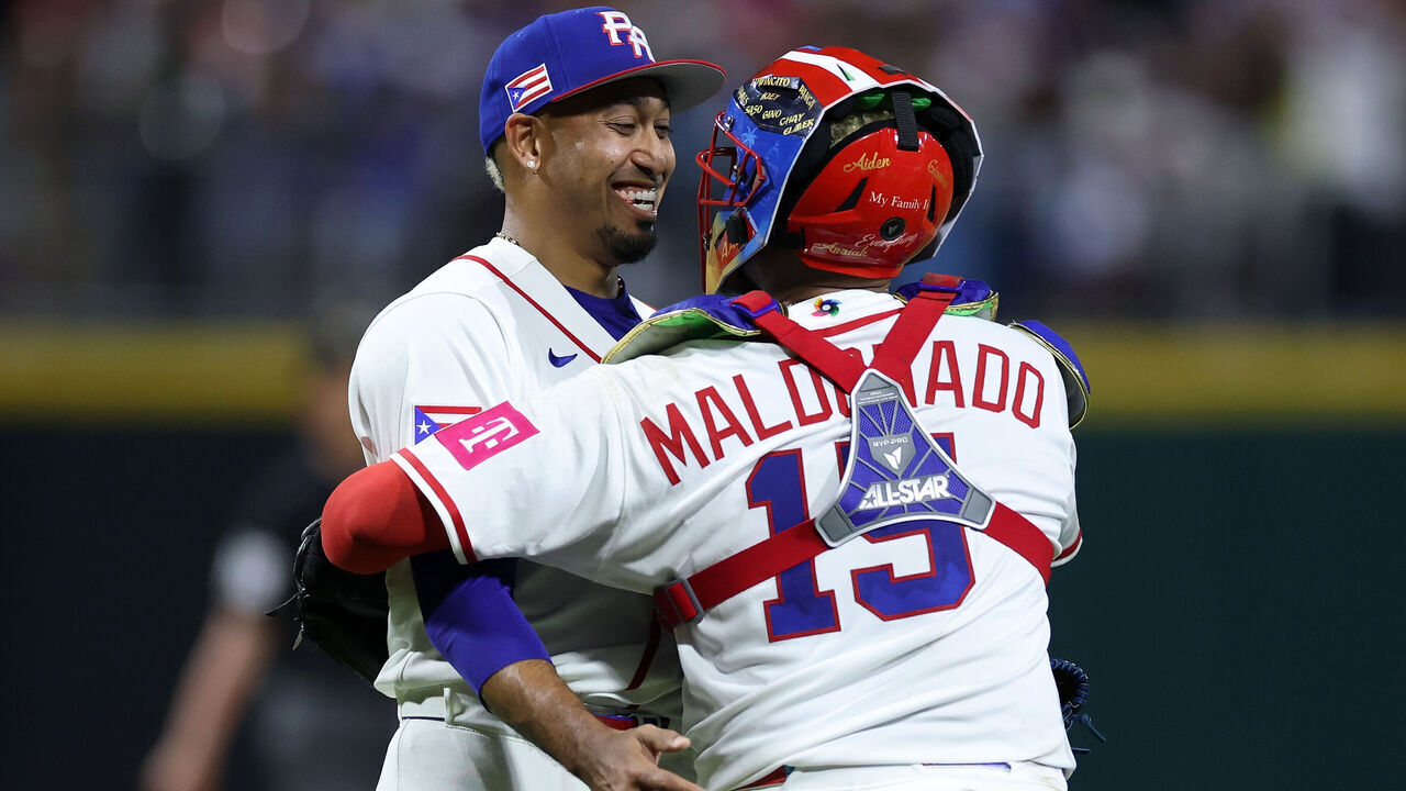 SAN JUAN, PUERTO RICO - MARCH 09: Fernando Cruz #63 and Martín Maldonado #15 of Team Puerto Rico celebrate a 4-1 victory against Team Cuba after the game during the 2026 World Baseball Classic at Hiram Bithorn Stadium on March 09, 2026 in San Juan, Puerto Rico.