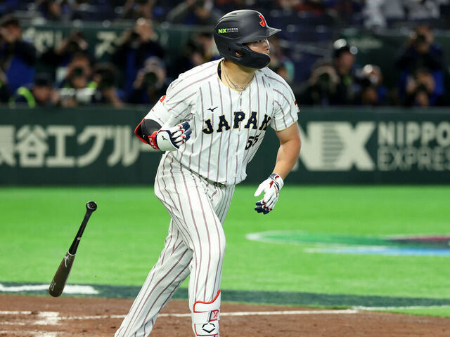 TOKYO, JAPAN - MARCH 10: Munetaka Murakami #55 of Team Japan tosses his bat after hitting a grand slam in the eighth inning during the 2026 World Baseball Classic Pool C game between Czechia and Japan at Tokyo Dome on March 10, 2026 in Tokyo, Japan.