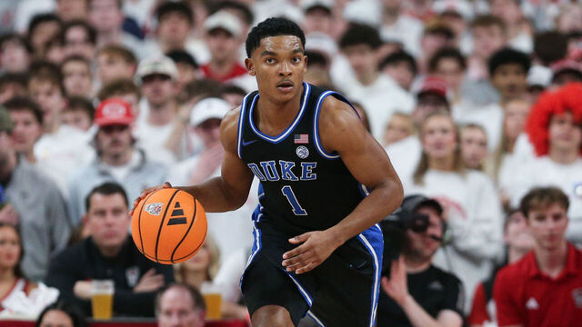 RALEIGH, NC - MARCH 02: Caleb Foster #1 of the Duke Blue Devils brings the ball up the court during the college basketball game between the NC State Wolfpack and the Duke Blue Devils on March 2, 2026 at the Lenovo Center in Raleigh, N.C.