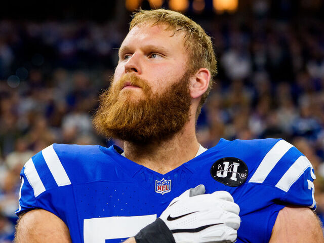 INDIANAPOLIS, INDIANA - NOVEMBER 30: Braden Smith #72 of the Indianapolis Colts holds hand over heart during National Anthem prior to an NFL football game against the Houston Texans at Lucas Oil Stadium on November 30, 2025 in Indianapolis, Indiana.