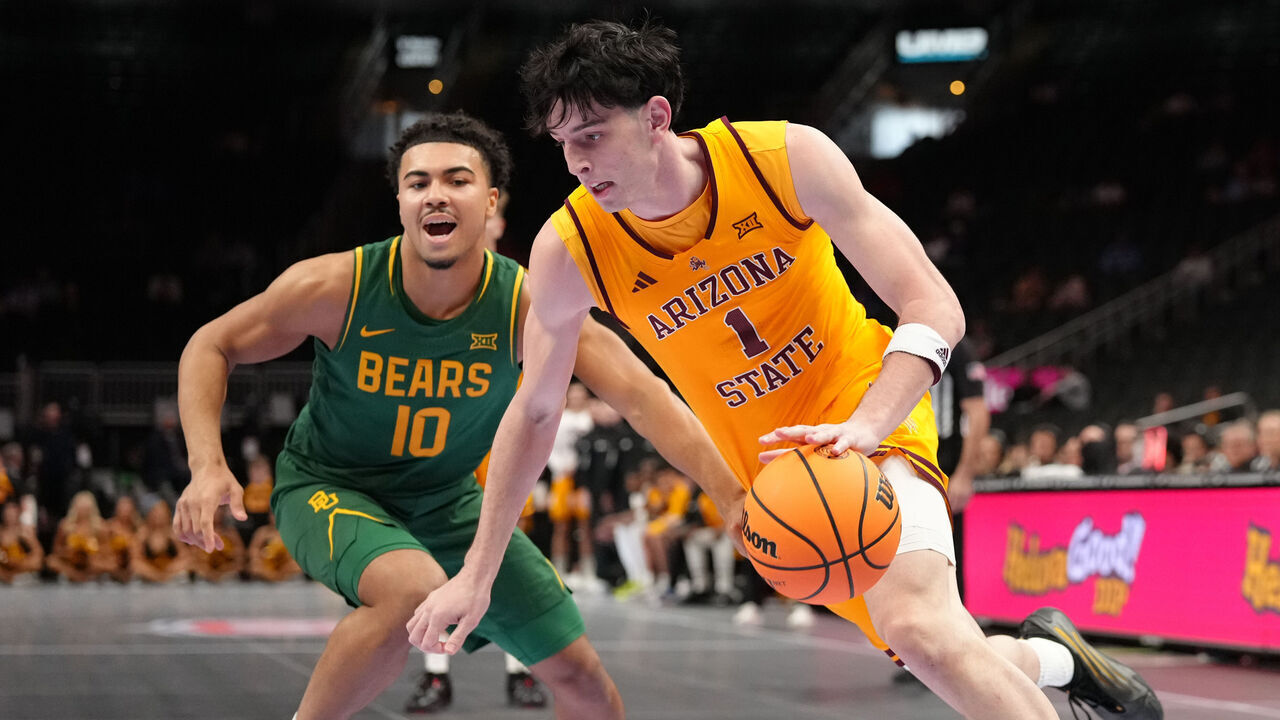 KANSAS CITY, MISSOURI - MARCH 10: Santiago Trouet #1 of the Arizona State Sun Devils drives against Isaac Williams #10 of the Baylor Bears in the first half during the first round game of the Men's 2026 Big 12 Tournament at T-Mobile Center on March 10, 2026 in Kansas City, Missouri.