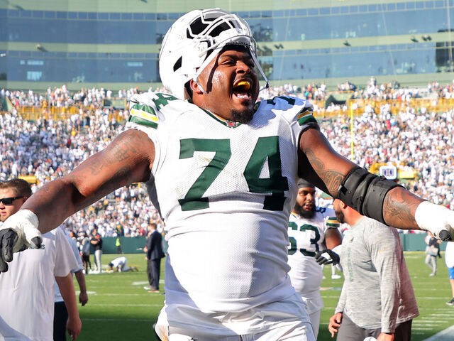 GREEN BAY, WISCONSIN - OCTOBER 20: Elgton Jenkins #74 of the Green Bay Packers celebrates after beating the Houston Texans 24-22 at Lambeau Field on October 20, 2024 in Green Bay, Wisconsin.