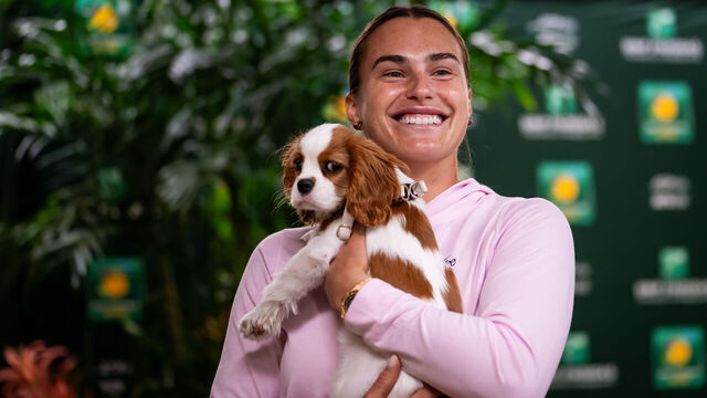 INDIAN WELLS, CALIFORNIA - MARCH 10: Aryna Sabalenka is accompanied by puppy Ash while talking to the media after defeating Naomi Osaka of Japan in the fourth round on Day 7 of the BNP Paribas Open at Indian Wells Tennis Garden on March 10, 2026 in Indian Wells, California.