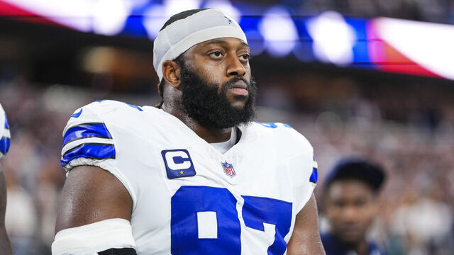 ARLINGTON, TX - NOVEMBER 23: Osa Odighizuwa #97 of the Dallas Cowboys looks on from the sideline during the national anthem prior to an NFL football game against the Philadelphia Eagles at AT&T Stadium on November 23, 2025 in Arlington, Texas.