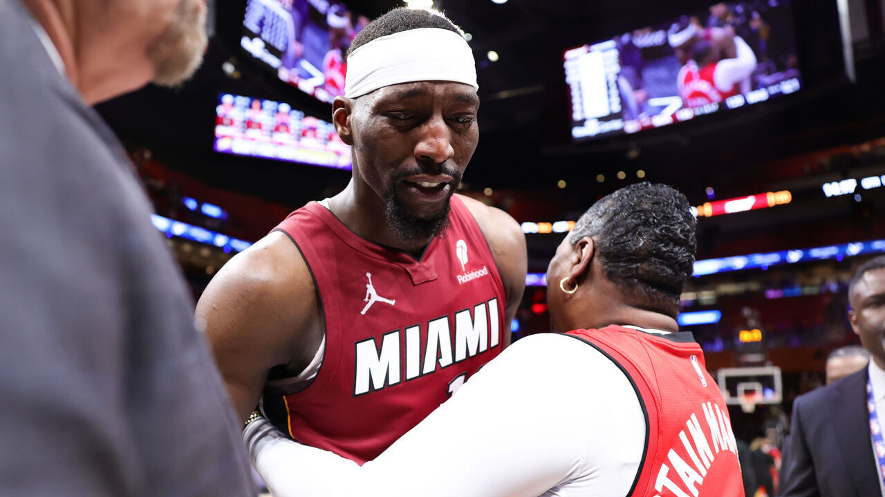 MIAMI, FLORIDA - MARCH 10: Bam Adebayo #13 of the Miami Heat embraces him mom after a game against the Washington Wizards at Kaseya Center on March 10, 2026 in Miami, Florida.