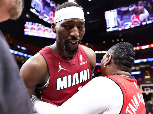 MIAMI, FLORIDA - MARCH 10: Bam Adebayo #13 of the Miami Heat embraces him mom after a game against the Washington Wizards at Kaseya Center on March 10, 2026 in Miami, Florida.
