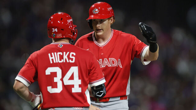 SAN JUAN, PUERTO RICO - MARCH 10: Owen Caissie #21 of Team Canada celebrates with Liam Hicks #34 after scoring a run on a single hit by Abraham Toro #31 (not pictured) against Team Puerto Rico during the fourth inning at Hiram Bithorn Stadium on March 10, 2026 in San Juan, Puerto Rico.