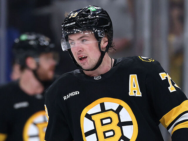 BOSTON, MASSACHUSETTS - MARCH 10: Charlie McAvoy #73 of the Boston Bruins looks on, with blood in his mouth, after the Bruins defeat the Los Angeles Kings 2-1 in overtime at TD Garden on March 10, 2026 in Boston, Massachusetts.