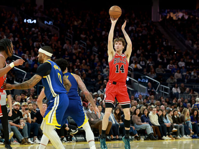 SAN FRANCISCO, CALIFORNIA - MARCH 10: Matas Buzelis #14 of the Chicago Bulls shoots over Gui Santos #15 of the Golden State Warriors at Chase Center on March 10, 2026 in San Francisco, California. NOTE TO USER: User expressly acknowledges and agrees that, by downloading and/or using this photograph, user is consenting to the terms and conditions of the Getty Images License Agreement.
