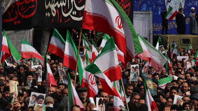 Iranians wave national flags as they attend the funerals of Iran's Revolutionary Guards Corps (IRGC) commanders, army commanders and others killed in the early days of the United States and Israeli strikes on Iran, at Enghelab Square in Tehran on March 11, 2026. Washington launched strikes with Israel on Iran on February 28, sparking retaliatory strikes by Tehran against Israel and US bases across the Gulf region. --AFP covers the war in the Middle East through its extensive regional network, including bureaus in Tehran, Jerusalem, and several neighboring countries. Since the start of the conflict, journalists have been working under increasingly restrictive conditions. Authorities in several countries have limited reporters' movements, photo and live video coverage from sensitive locations. Some governments and armed groups have banned images of missile or drone strikes and other security-related sites. /