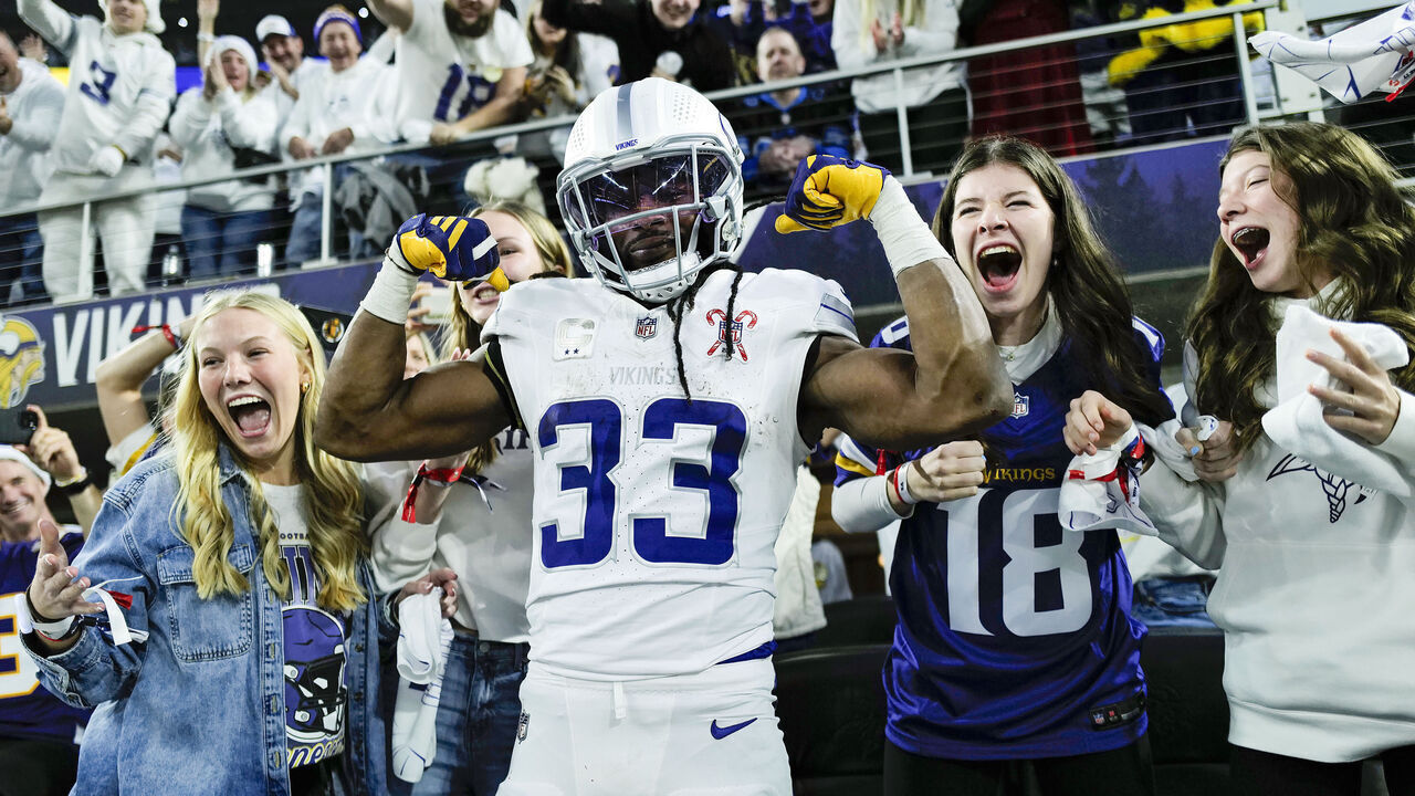 MINNEAPOLIS, MINNESOTA - DECEMBER 25: Aaron Jones Sr. #33 of the Minnesota Vikings celebrates his rushing touchdown against the Detroit Lions Jameson Williams #1 during the first quarter at U.S. Bank Stadium on December 25, 2025 in Minneapolis, Minnesota.