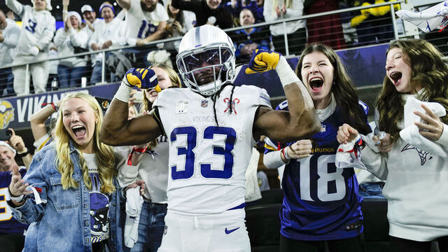 MINNEAPOLIS, MINNESOTA - DECEMBER 25: Aaron Jones Sr. #33 of the Minnesota Vikings celebrates his rushing touchdown against the Detroit Lions Jameson Williams #1 during the first quarter at U.S. Bank Stadium on December 25, 2025 in Minneapolis, Minnesota.