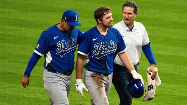 HOUSTON, TEXAS - MARCH 10: Kyle Teel #3 of Italy is escorted off the field after being injured running to second base in the sixth inning during the World Baseball Classic Pool B game between Italy and the United States at Daikin Park on March 10, 2026 in Houston, Texas.