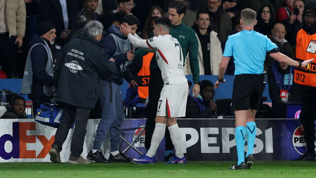 PARIS, FRANCE - MARCH 11: Pedro Neto of Chelsea embraces a ball kid following an altercation where the ball kid was pushed by Pedro Neto during the UEFA Champions League 2025/26 Round of 16 First Leg match between Paris Saint-Germain FC and Chelsea FC at Parc des Princes on March 11, 2026 in Paris, France.