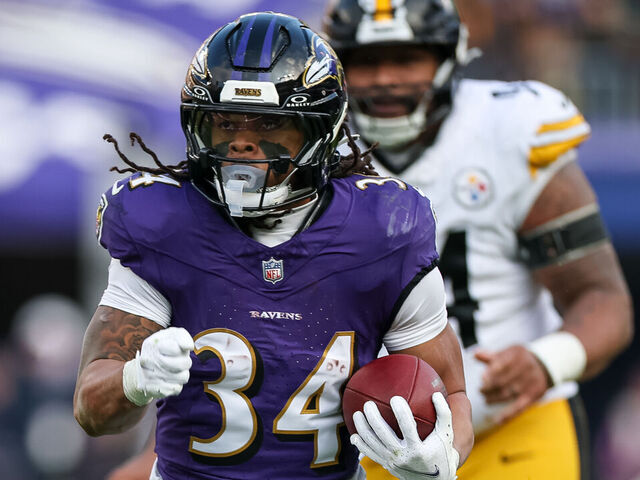 BALTIMORE, MD - DECEMBER 07: Keaton Mitchell #34 of the Baltimore Ravens carries the ball against the Pittsburgh Steelers during the second half at M&T Bank Stadium on December 7, 2025 in Baltimore, Maryland.