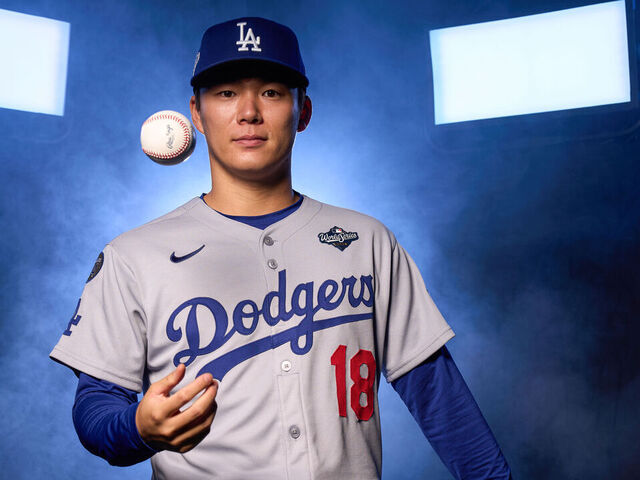 TORONTO, ON - OCTOBER 23: Yoshinobu Yamamoto #18 of the Los Angeles Dodgers poses for a photo during the 2025 World Series photoshoot at the Rogers Centre on Thursday, October 23, 2025 in Toronto, Ontario, Canada.
