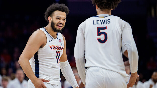 CHARLOTTE, NORTH CAROLINA - MARCH 12: Devin Tillis #11 celebrates with Sam Lewis #5 of the Virginia Cavaliers in the first half against the NC State Wolfpack during the quarterfinals of the 2026 Men's ACC Tournament at Spectrum Center on March 12, 2026 in Charlotte, North Carolina.