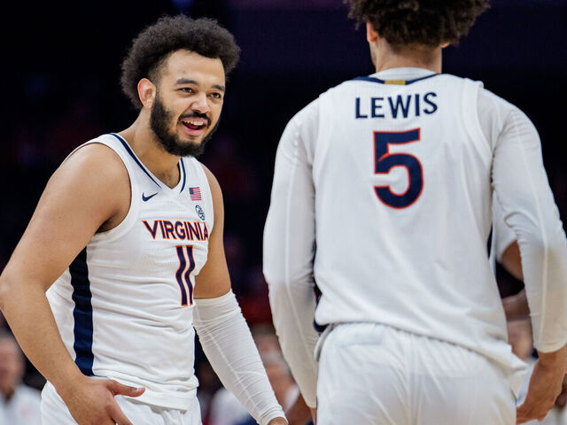 CHARLOTTE, NORTH CAROLINA - MARCH 12: Devin Tillis #11 celebrates with Sam Lewis #5 of the Virginia Cavaliers in the first half against the NC State Wolfpack during the quarterfinals of the 2026 Men's ACC Tournament at Spectrum Center on March 12, 2026 in Charlotte, North Carolina.