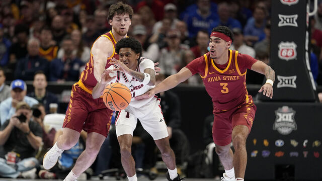 KANSAS CITY, MISSOURI - MARCH 12: Jaylen Petty #11 of the Texas Tech Red Raiders loose control of the ball against Nate Heise #0 and Tamin Lipsey #3 of the Iowa State Cyclones in first half during the quarterfinals of the Big 12 Tournament at T-Mobile Center on March 12, 2026 in Kansas City, Missouri.