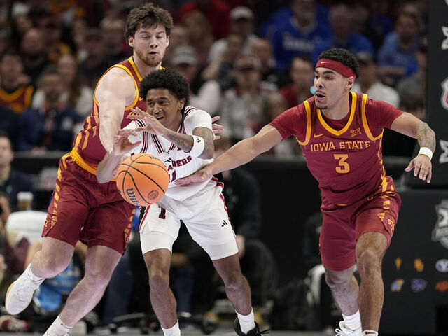 KANSAS CITY, MISSOURI - MARCH 12: Jaylen Petty #11 of the Texas Tech Red Raiders loose control of the ball against Nate Heise #0 and Tamin Lipsey #3 of the Iowa State Cyclones in first half during the quarterfinals of the Big 12 Tournament at T-Mobile Center on March 12, 2026 in Kansas City, Missouri.