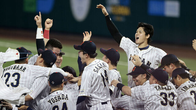 MIAMI, FL - MARCH 21: Shohei Ohtani #16 of Team Japan celebrates with his teammates after the final out in the top of the 9th inning to defeat Team USA 3-2 during World Baseball Classic Championship at loanDepot park on March 21, 2023 in Miami, Florida.