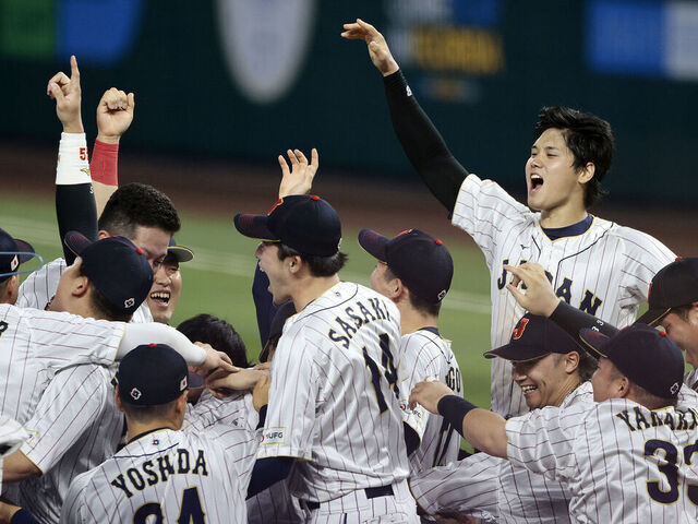 MIAMI, FL - MARCH 21: Shohei Ohtani #16 of Team Japan celebrates with his teammates after the final out in the top of the 9th inning to defeat Team USA 3-2 during World Baseball Classic Championship at loanDepot park on March 21, 2023 in Miami, Florida.