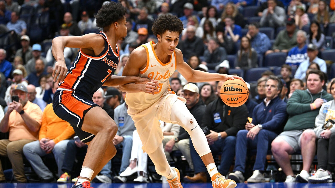 NASHVILLE, TENNESSEE - MARCH 12: Nate Ament #10 of the Tennessee Volunteers dribbles against Keyshawn Hall #7 of the Auburn Tigers during the first half in the second round of the 2026 SEC Men's Basketball Tournament at Bridgestone Arena on March 12, 2026 in Nashville, Tennessee.