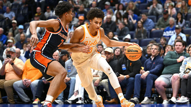NASHVILLE, TENNESSEE - MARCH 12: Nate Ament #10 of the Tennessee Volunteers dribbles against Keyshawn Hall #7 of the Auburn Tigers during the first half in the second round of the 2026 SEC Men's Basketball Tournament at Bridgestone Arena on March 12, 2026 in Nashville, Tennessee.
