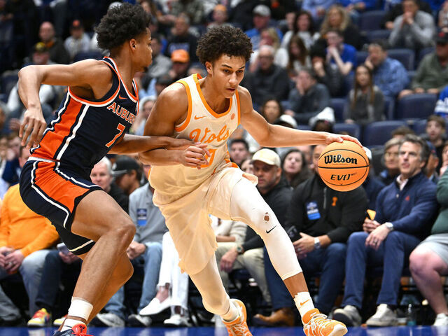 NASHVILLE, TENNESSEE - MARCH 12: Nate Ament #10 of the Tennessee Volunteers dribbles against Keyshawn Hall #7 of the Auburn Tigers during the first half in the second round of the 2026 SEC Men's Basketball Tournament at Bridgestone Arena on March 12, 2026 in Nashville, Tennessee.
