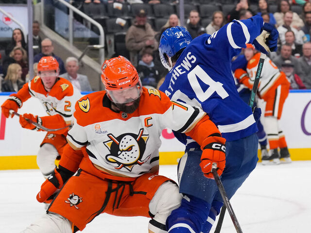 TORONTO, CANADA - MARCH 12: Radko Gudas #7 of the Anaheim Ducks takes a kneeing penalty against Auston Matthews #34 of the Toronto Maple Leafs in the second period at Scotiabank Arena on March 12, 2026 in Toronto, Ontario, Canada.