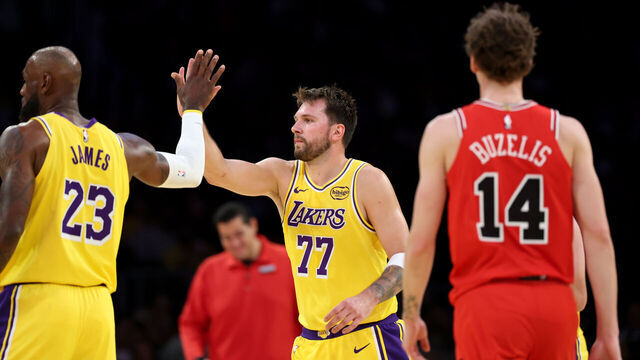Los Angeles, CA - March 12: Lakers forward LeBron James, #23, and Lakers guard Luka Doncic, #77 high-five as Bulls forward Matas Buzelis, #14, right, watches in the second half at Crypto.com Arena in Los Angeles Thursday, March 12, 2026. (Allen J. Schaben / Los Angeles Times via Getty Images)