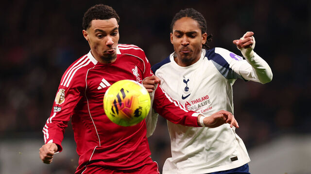 LONDON, ENGLAND - DECEMBER 20: Hugo Ekitike of Liverpool competes for the ball with Djed Spence of Tottenham Hotspur during the Premier League match between Tottenham Hotspur and Liverpool at Tottenham Hotspur Stadium on December 20, 2025 in London, England.