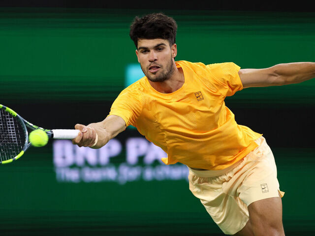 INDIAN WELLS, CALIFORNIA - MARCH 12: Carlos Alcaraz of Spain plays a forehand against Cameron Norrie of Great Britain in their quarterfinal match of the BNP Paribas Open at Indian Wells Tennis Garden on March 12, 2026 in Indian Wells, California.
