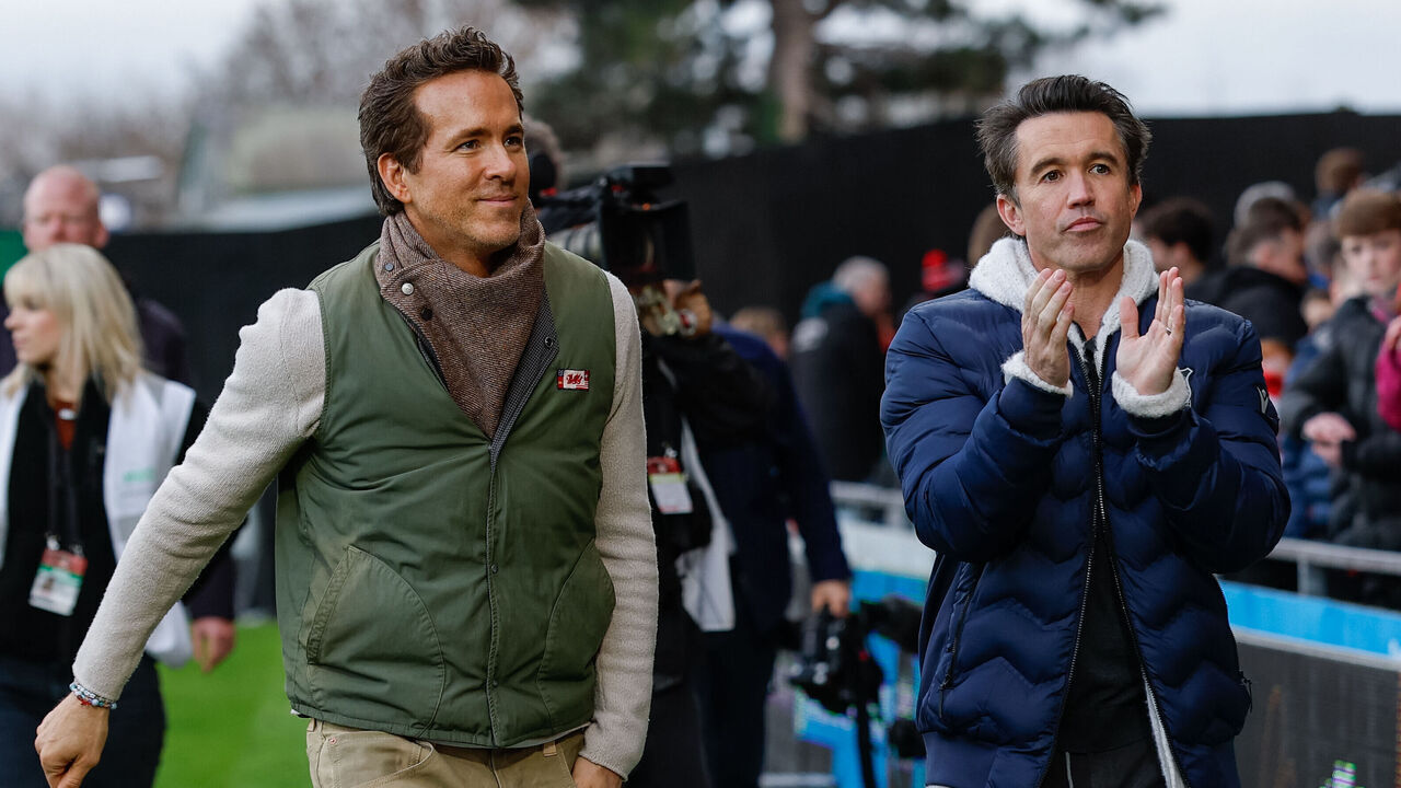 Wrexham co-owners Ryan Reynolds (left) and Rob Mac (right) acknowledge the fans ahead of the Sky Bet Championship match at the Stok Cae Ras, Wrexham. Picture date: Saturday December 13, 2025.