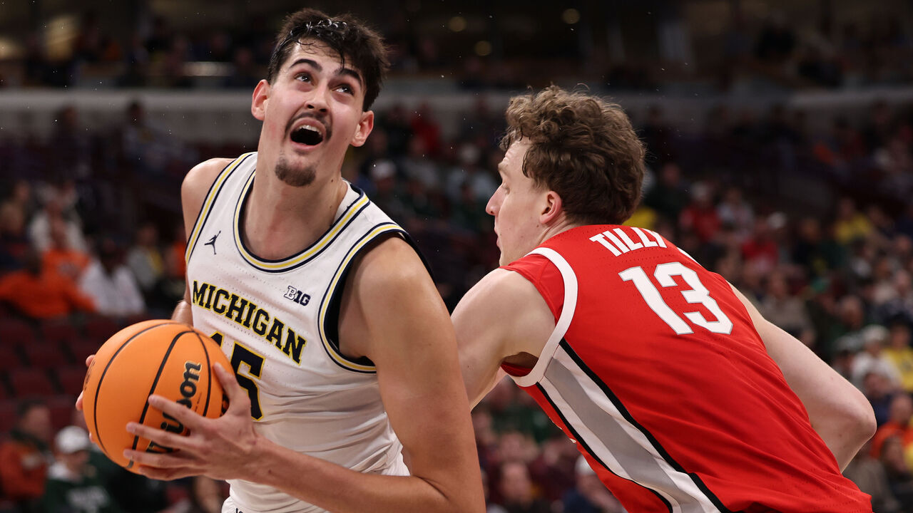 CHICAGO, ILLINOIS - MARCH 13: Aday Mara #15 of the Michigan Wolverines drives past Christoph Tilly #13 of the Ohio State Buckeyes in the first half during the quarterfinals of the 2026 Big Ten Men's Basketball Tournament at the United Center on March 13, 2026 in Chicago, Illinois.