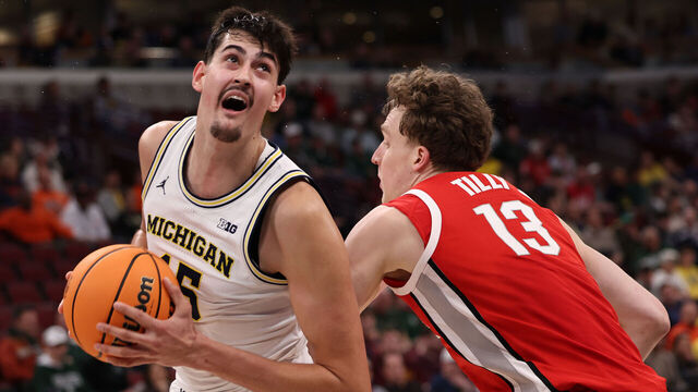 CHICAGO, ILLINOIS - MARCH 13: Aday Mara #15 of the Michigan Wolverines drives past Christoph Tilly #13 of the Ohio State Buckeyes in the first half during the quarterfinals of the 2026 Big Ten Men's Basketball Tournament at the United Center on March 13, 2026 in Chicago, Illinois.