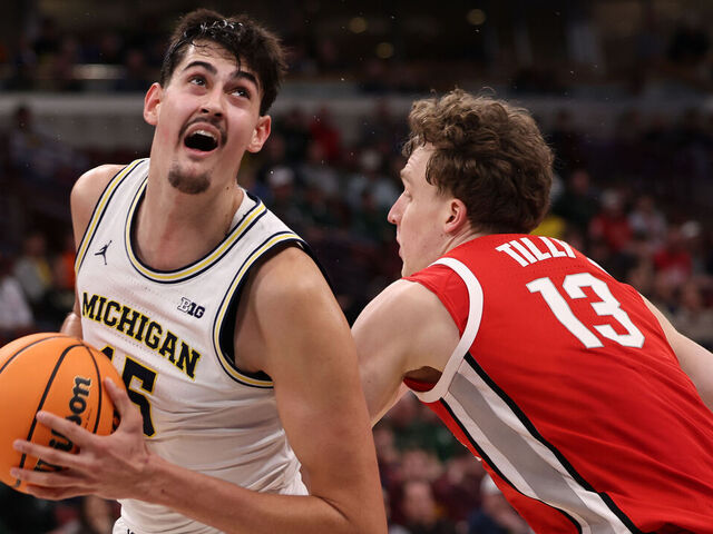 CHICAGO, ILLINOIS - MARCH 13: Aday Mara #15 of the Michigan Wolverines drives past Christoph Tilly #13 of the Ohio State Buckeyes in the first half during the quarterfinals of the 2026 Big Ten Men's Basketball Tournament at the United Center on March 13, 2026 in Chicago, Illinois.