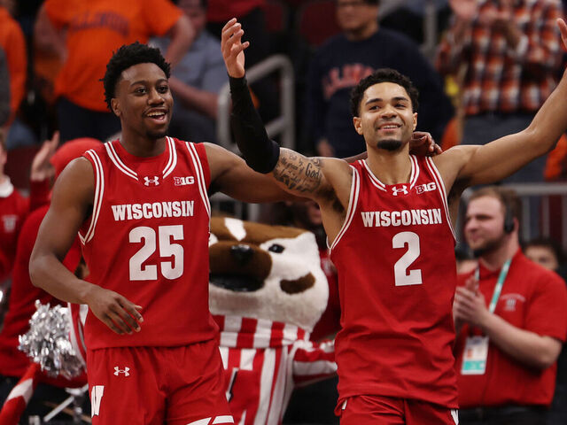 CHICAGO, ILLINOIS - MARCH 13: Nick Boyd #2 and John Blackwell #25 of the Wisconsin Badgers celebrate in the second half against the Illinois Fighting Illini during the quarterfinals of the 2026 Big Ten Men's Basketball Tournament at the United Center on March 13, 2026 in Chicago, Illinois.