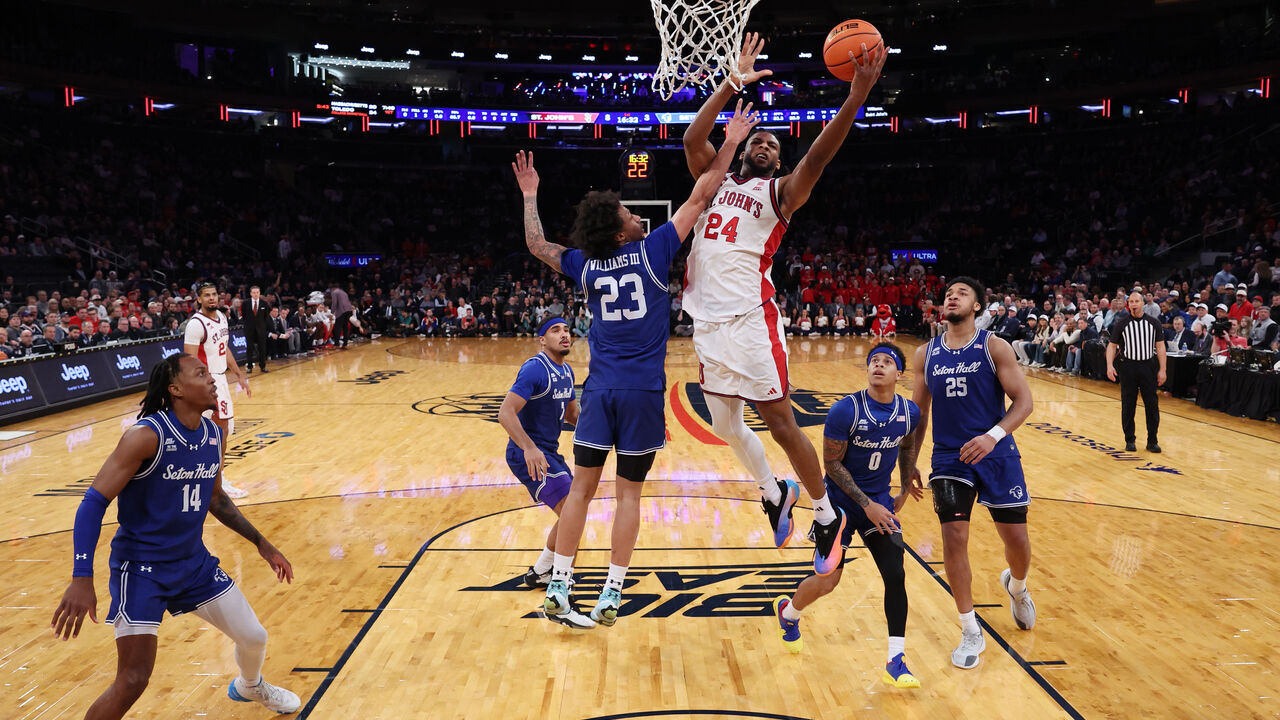 NEW YORK, NEW YORK - MARCH 13: Zuby Ejiofor #24 of the St. John's Red Storm goes to the basket as Mike Williams #23 of the Seton Hall Pirates defends during the 2026 Big East Men's Tournament - Semifinal game at Madison Square Garden on March 13, 2026 in New York City.