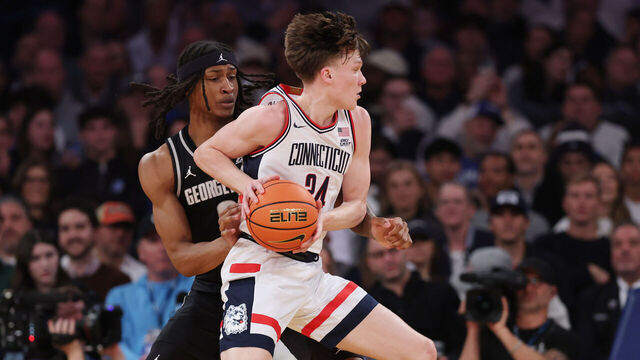 NEW YORK, NEW YORK - MARCH 13: Braylon Mullins #24 of the Connecticut Huskies dribbles as Jayden Fort #0 of the Georgetown Hoyas defends during the first half of the 2026 Big East Men's Tournament - Semifinal game at Madison Square Garden on March 13, 2026 in New York City.