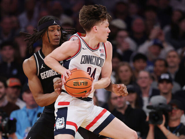 NEW YORK, NEW YORK - MARCH 13: Braylon Mullins #24 of the Connecticut Huskies dribbles as Jayden Fort #0 of the Georgetown Hoyas defends during the first half of the 2026 Big East Men's Tournament - Semifinal game at Madison Square Garden on March 13, 2026 in New York City.