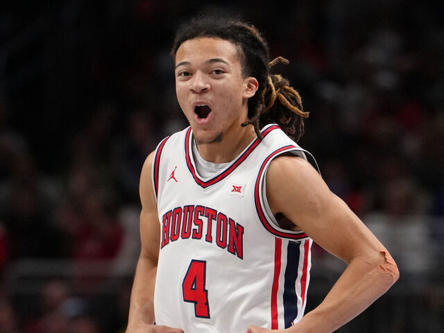 KANSAS CITY, MISSOURI - MARCH 13: Kingston Flemings #4 of the Houston Cougars celebrates against the Kansas Jayhawks in the second half during the semifinals of the Big 12 Tournament at T-Mobile Center on March 13, 2026 in Kansas City, Missouri.