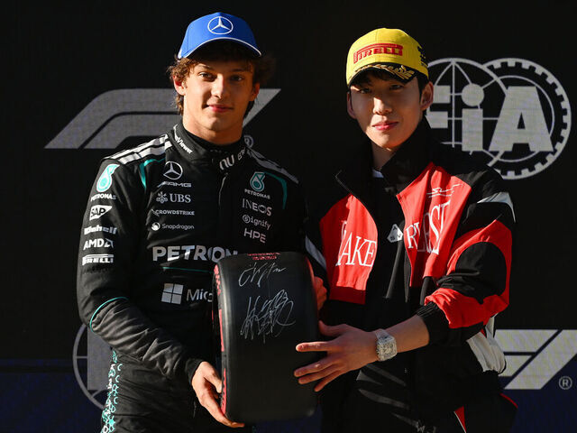 SHANGHAI, CHINA - MARCH 14: Pole position qualifier Andrea Kimi Antonelli of Italy and Mercedes AMG Petronas F1 Team receives his Pirelli Pole Position award from Lin Xiaojun during qualifying ahead of the F1 Grand Prix of China at Shanghai International Circuit on March 14, 2026 in Shanghai, China.