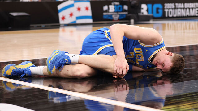 CHICAGO, ILLINOIS - MARCH 13: Tyler Bilodeau #34 of the UCLA Bruins reacts after being injured against the Michigan State Spartans during the first half in the quarterfinals of the 2026 Big Ten Men's Basketball Tournament at the United Center on March 13, 2026 in Chicago, Illinois.