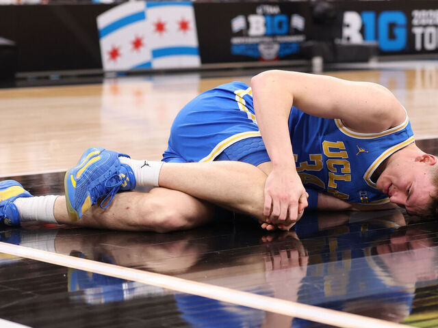 CHICAGO, ILLINOIS - MARCH 13: Tyler Bilodeau #34 of the UCLA Bruins reacts after being injured against the Michigan State Spartans during the first half in the quarterfinals of the 2026 Big Ten Men's Basketball Tournament at the United Center on March 13, 2026 in Chicago, Illinois.