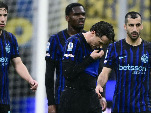 Inter Milan's Polish midfielder #7 Piotr Zielinski (2R) reacts at the end of the Italian Serie A football match between Inter Milan and Atalanta at the San Siro stadium in Milan, northern Italy, on March 14, 2026.