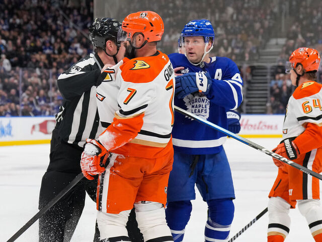 TORONTO, CANADA - MARCH 12: Morgan Rielly #44 of the Toronto Maple Leafs confronts Radko Gudas #7 of the Anaheim Ducks after kneeing Auston Matthews #34 (not shown) in the second period at Scotiabank Arena on March 12, 2026 in Toronto, Ontario, Canada.