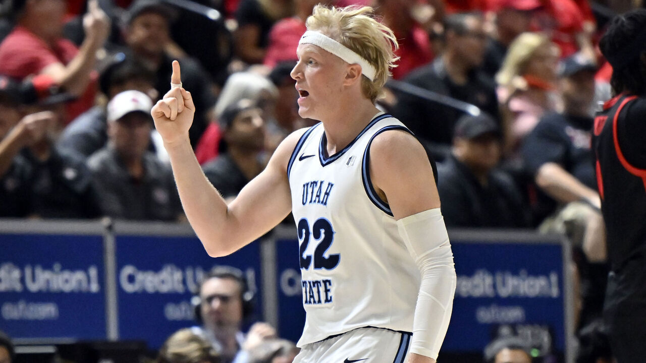 LAS VEGAS, NEVADA - MARCH 14: Karson Templin #22 of the Utah State Aggies asks for a review of a referee's call against the San Diego State Aztecs during the first half of the championship game of the Mountain West Conference men’s basketball tournament at the Thomas & Mack Center on March 14, 2026 in Las Vegas, Nevada.